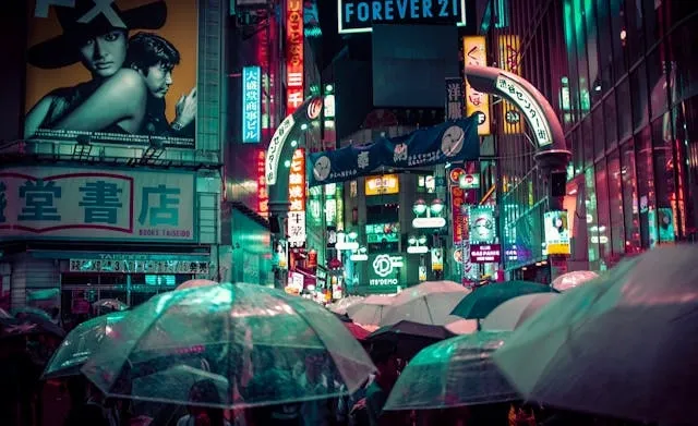 umbrellas at night in a busy street for movies with neon lights