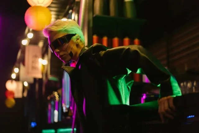a woman wearing black clothing and sunglasses for movies with neon lights