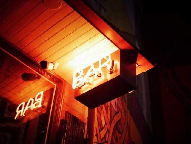 a neon bar sign installed outdoors for can neon signs be used outdoors