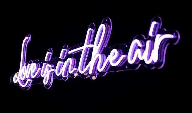 a purple neon sign for do neon signs need to be plugged in