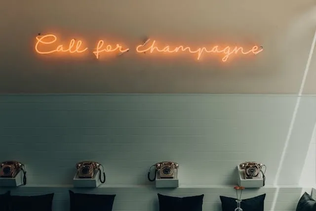 an orange neon sign indoors for do neon signs need to be plugged in