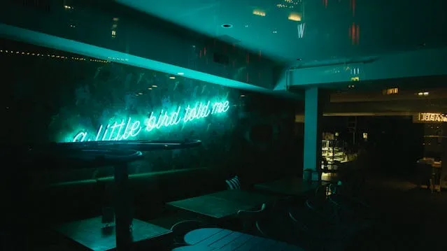 blue neon light inside a bar for best custom neon signs