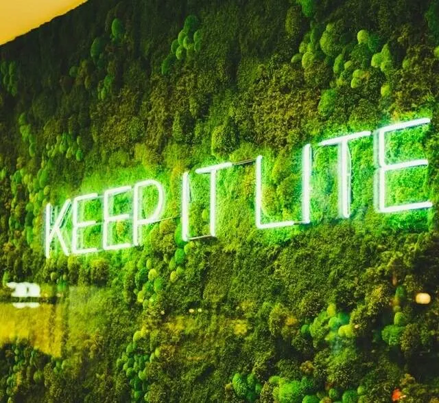 neon sign on leafy background for how to hang neon sign on backdrop