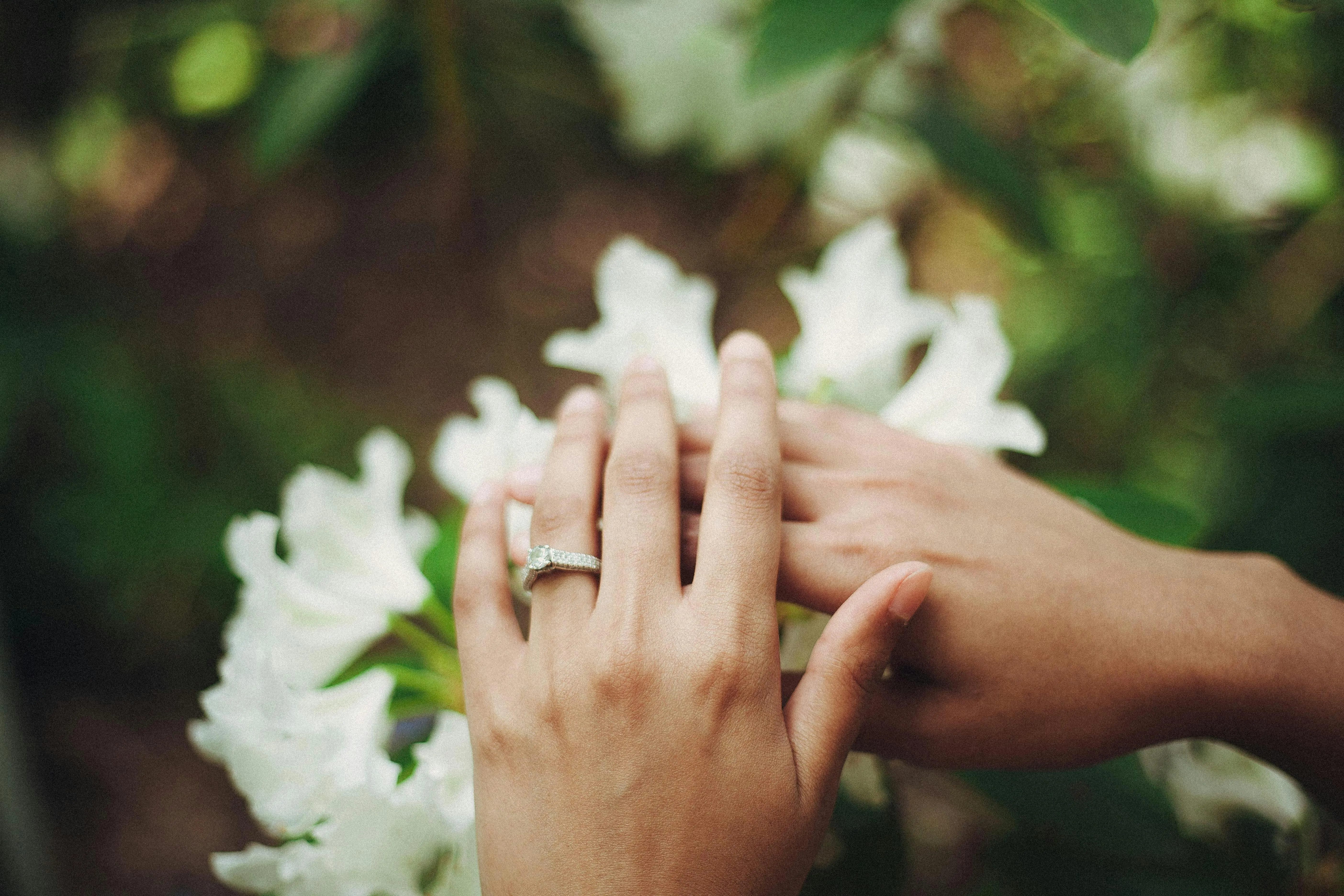 a woman’s hands with a ring for engagement party ideas